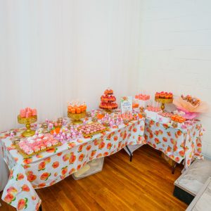 mouthwatering display of cupcakes, cookies, and sweets at a peach-themed baby shower in Queens. Ridgewood Hall delivers sweet moments and elegant setups for every occasion.