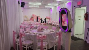 Beautiful pink-themed event setup at Ridgewood Hall in Queens, NY. Elegant table settings, photo booth, balloon décor, and spacious layout perfect for baby showers, birthdays, and celebrations. A modern and affordable party hall designed to impress guests.