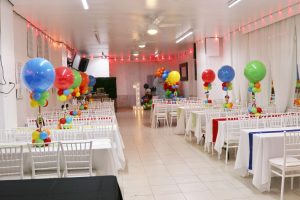 Bright and colorful kids party setup at Abyss Hall in Queens. Perfect space for birthdays, family events, and fun celebrations with vibrant balloon centerpieces and modern seating.