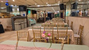 Elegant event setup at Medina Hall featuring pastel table decor and gold chairs. A spacious and versatile party hall in Queens perfect for any celebration.