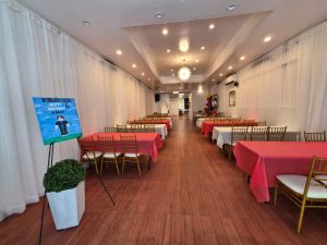 Spacious decorated event hall at Twilight Hall in Queens. Set up for a birthday party with tables, chairs, and colorful decor. Great venue for family events.