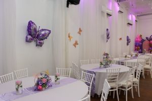 Celebrate life’s milestones in style! This baby shower setup at Ridgewood Hall features beautiful balloon decorations, butterfly wall art, and custom decor under soft purple lighting — perfect for intimate family events.