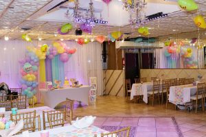 A beautiful pastel-themed baby shower at Medina Hall with colorful balloons and charming table settings. A perfect venue for family celebrations in Queens.