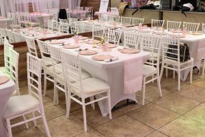 Soft white drapes and ambient lighting set the scene at Occasions Hall. A classy venue choice for baby showers, bridal events, or intimate receptions.