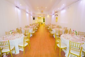 Round tables with gold chairs