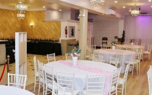 Twilight Hall event space with white Chiavari chairs and soft pink table runner setup – perfect for baby showers, birthdays, and bridal showers in NYC.