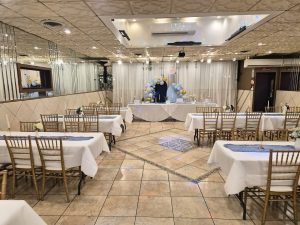 A wide-angle view of Medina Hall showcasing its spacious layout and elegant blue-themed decor. Perfect for large gatherings and special celebrations.